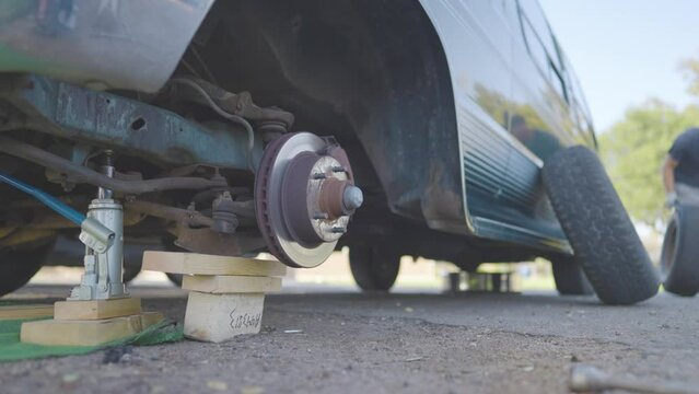 Man Changes Tire - Slow Motion