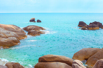 Blue sea with large boulders in the water. Beautiful seascape. Travel and tourism