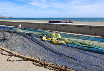Traditional fishing nets drying at the edge of the beach in Estepona in Spain