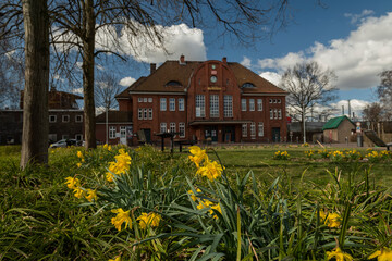 The ancient building of the railway station in the spring in the city of Langenhagen. Hanover. Germany