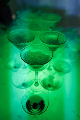 Glasses of champagne with dry ice. Champagne slide. Pyramid or fountain made of champagne glasses