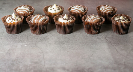 Little chocolate cupcakes on a table with copy space availble
