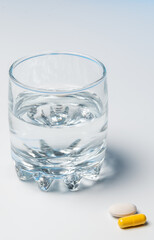 glass of water with pills