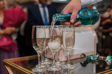 Glasses of white sparkling wine on the table. serving wine