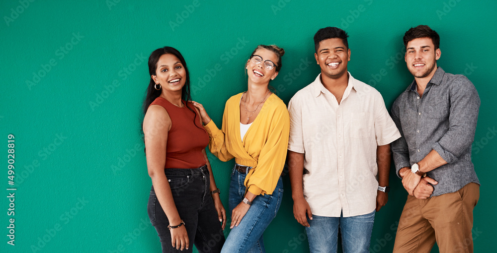 Poster optimism is a strategy for making a better future. portrait of a group of young designers standing t