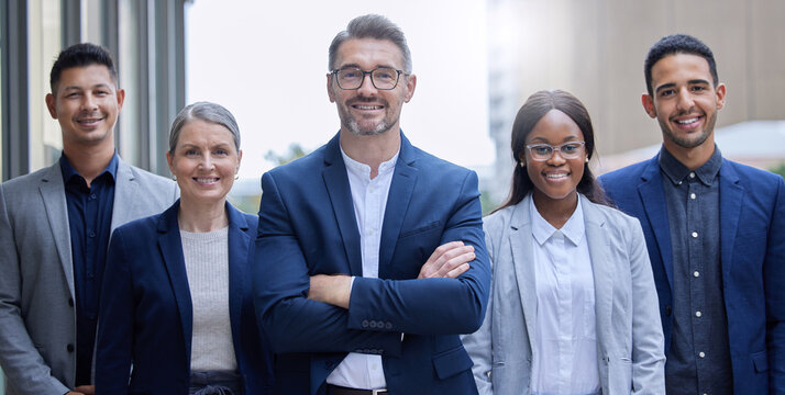 Were the team you need. Cropped portrait of a group of corporate businesspeople standing outside with their arms folded.