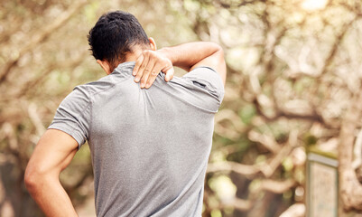 You didnt come this far to only come this far. Rearview shot of an unrecognisable man experiencing neck pain while working out in nature. © Azeemud-Deen Jacobs/peopleimages.com
