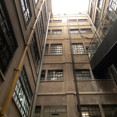 Fototapeta premium Building facade with windows and bricks