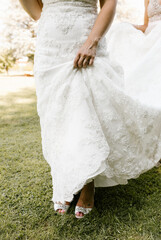 Fototapeta na wymiar bride holding wedding dress