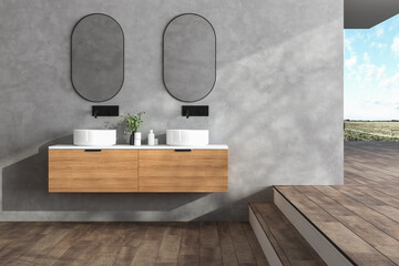 Corner of minimalist panoramic bathroom with concrete wall, parquet floor, double sink with round mirrors. Blurry landscape view. 3d rendering
