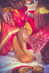 Indian pre wedding haldi ceremony turmeric, hands, feet close up