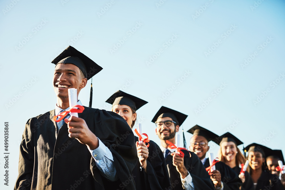 Poster be the change that you want to see. shot of a smiling university student on graduation day with clas