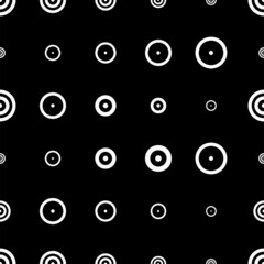 Vector illustration. Geometric seamless pattern. Solid dots and linear circles in rows. Spotted black and white background. Simple monochrome abstract pattern.