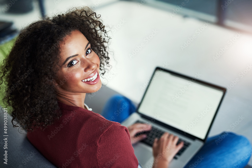 Poster this is the blog im working on. portrait of a young woman using a laptop while relaxing on the sofa 