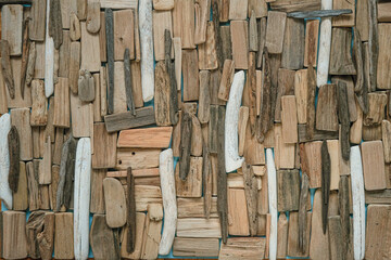 sea snags on blue background. driftwood wall.Gray and brown sea driftwood texture.driftwood...