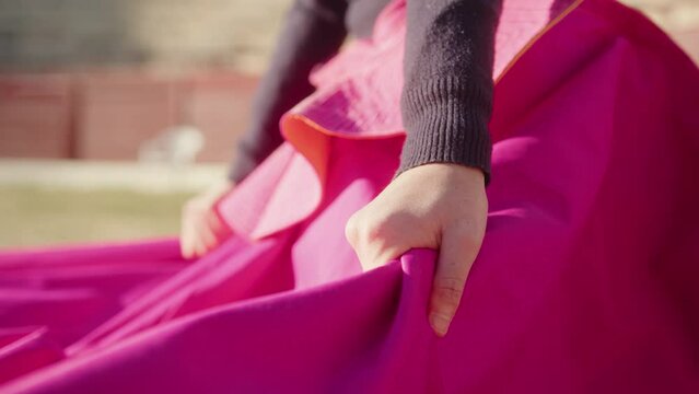 Female Matador With Muleta In The Bullring. - close up