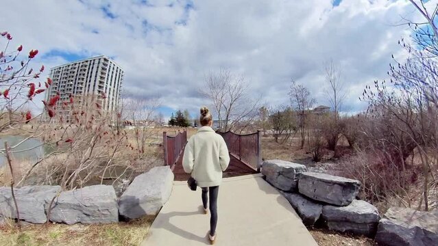 hyperlapse , Young women walking though the park on a spring sunny day