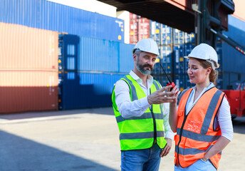 Executives, businessmen and engineers or foremen check control Warehouse at the container yard