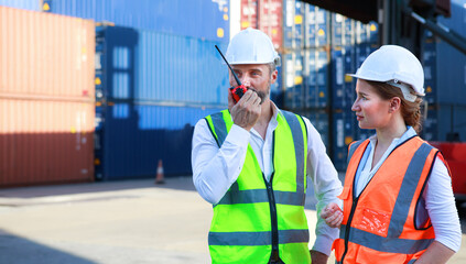Executives, businessmen and engineers or foremen check control Warehouse at the container yard