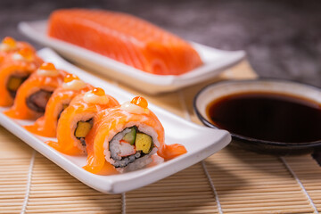 Delicious sushi arranged in plates and ready to serve.