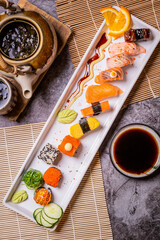 Fototapeta na wymiar Delicious sushi arranged in plates and ready to serve.