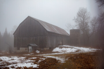 An old barn captured in the fog