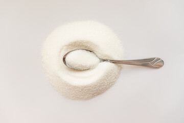 the concept of the benefits and harms of sugar, white on white. hyperglycemia, hypoglycemia....