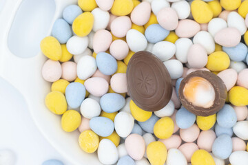 Fototapeta na wymiar cadbury creme egg on top of candy eggs
