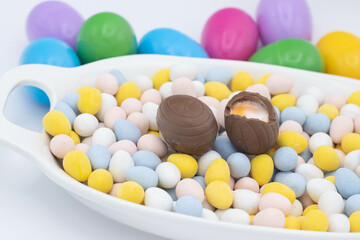 Fototapeta na wymiar cadbury creme egg on top of candy eggs
