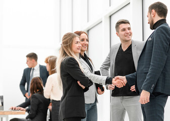 business colleagues greeting each other with a handshake