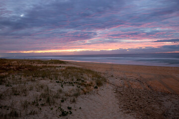 Fototapeta na wymiar Red Sky Sunrise Surf Beach Sand Dunes Gold Coast Australia