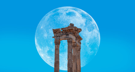 Columns of the ancient city of Pergamon with Lunar eclipse (full moon) - Bergama - Turkey 