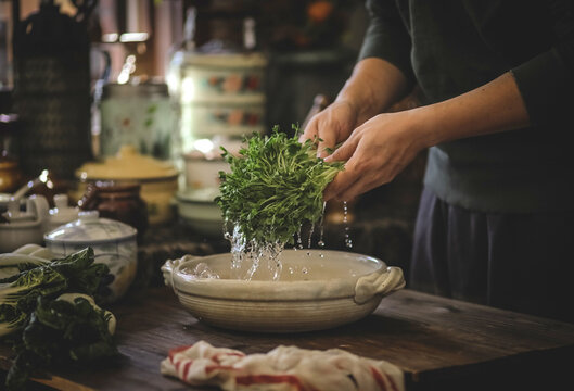 Close up of the chef washing vegetable and hands