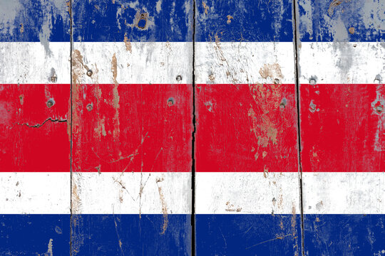Costa rica flag on a rustic old cracked wooden surface