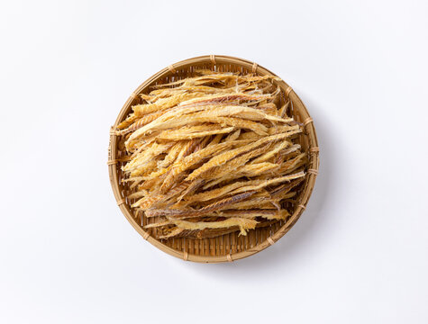 Thinly sliced dried pollack in a traditional basket viewed from above
