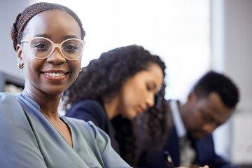 Obraz premium Success starts in the boardroom. Cropped portrait of an attractive young businesswoman sitting in the boardroom with her colleagues during a meeting.