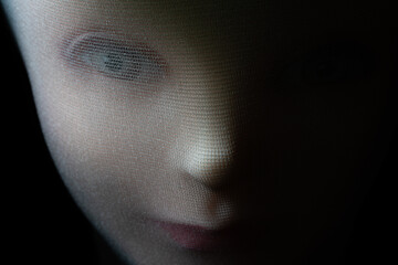 A girl doll isolated on black background with copy space.