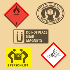 Set of fragile sticker handle with care and case icon packaging symbols sign, Do Not Place Near Magnets, Flammable liquids, Explosives  rubber stamp on cardboard background. Use on package.
