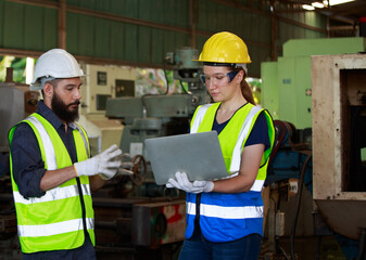 A team of professional male and female engineers with quality skills, inspecting, controlling, and maintaining machines