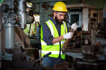 Portrait of a male engineer, professional, skilled labor, quality skills, inspecting and controlling machines.