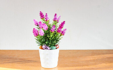 Horizontal view of small Easter eggs and decorative flowers. Background with copy space. Selective focus. Happy Easter.