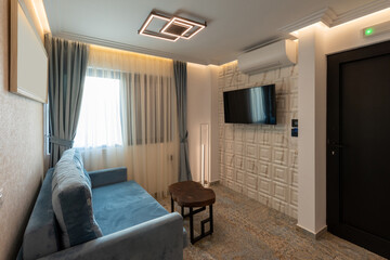 Living room interior with wall mounted tv