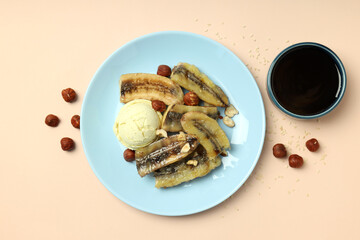 Concept of tasty food with grilled banana on beige background