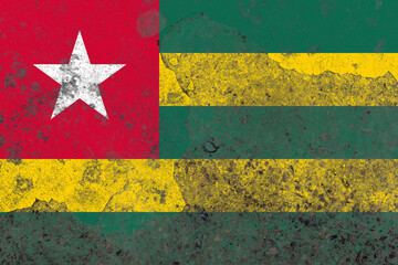 Togo flag on a grungy old concrete wall surface