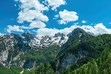 Fototapeta na wymiar Scenic view on the rocky sharp summits in Kamnik Savinja Alps in Carinthia, border Austria and Slovenia. Mountain peaks in the Vellacher Kotschna in spring. Mountaineering. Freedom. Jezerska Kocna
