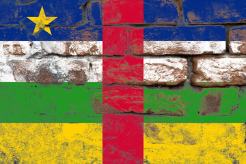 Distressed old central african republic flag on a concrete wall surface