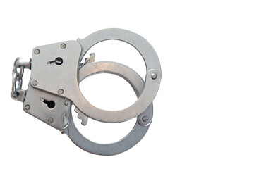 Metal handcuffs on a white isolated background, copy space