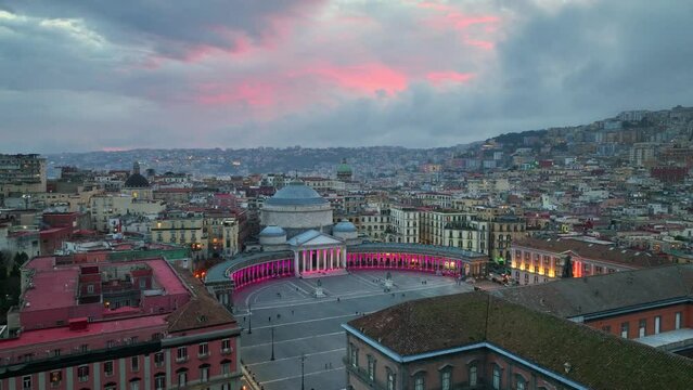 Aerial view of downtown Naples at sunset, flying above Piazza del Plebiscito (Main Square) and San Francesco di Paola Basilica, tourism in southern Italy 