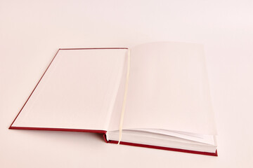 The unfolded cover of the book lies on the table. Reading books at leisure.