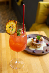 Cocktail in cafe with orange and ice